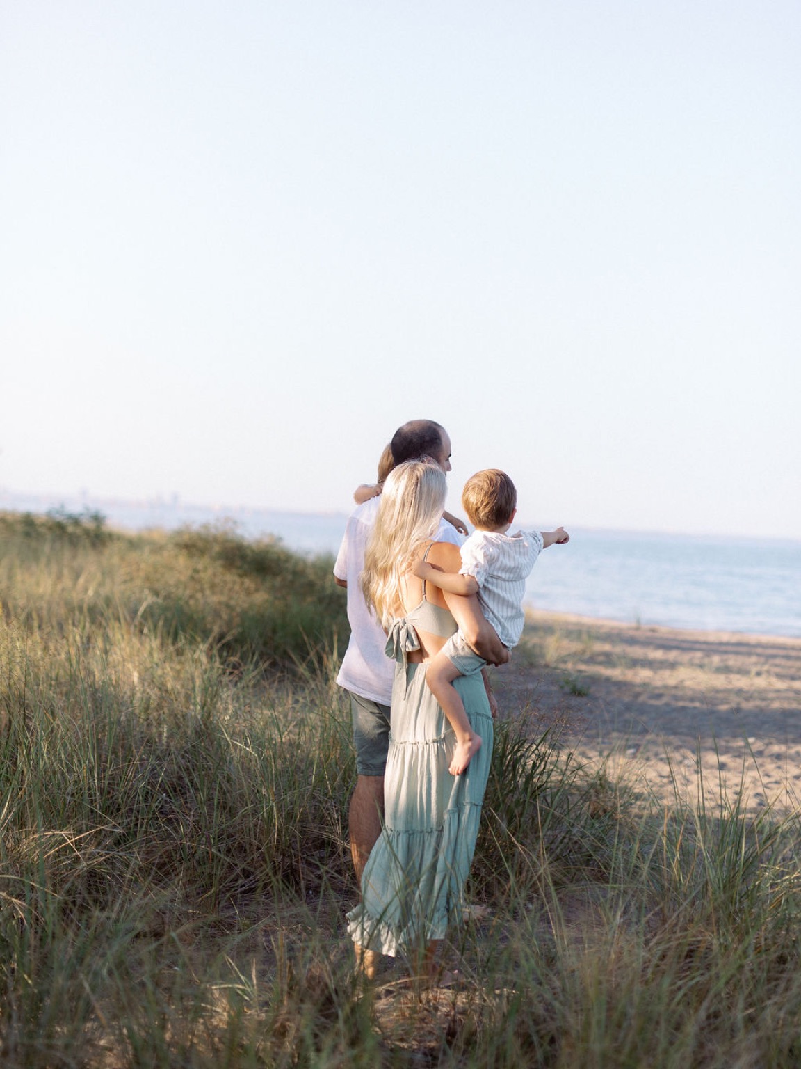 A family taking in the Hamilton Beach shoreline