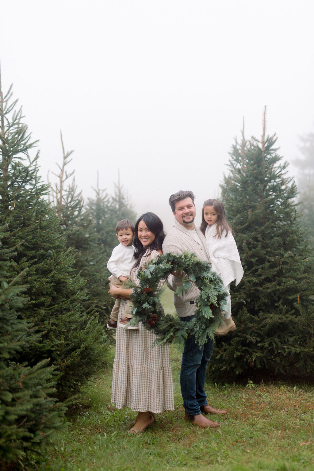 A natural family moment among the evergreens